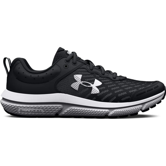 Black Under Armour kids running shoes with a white sole