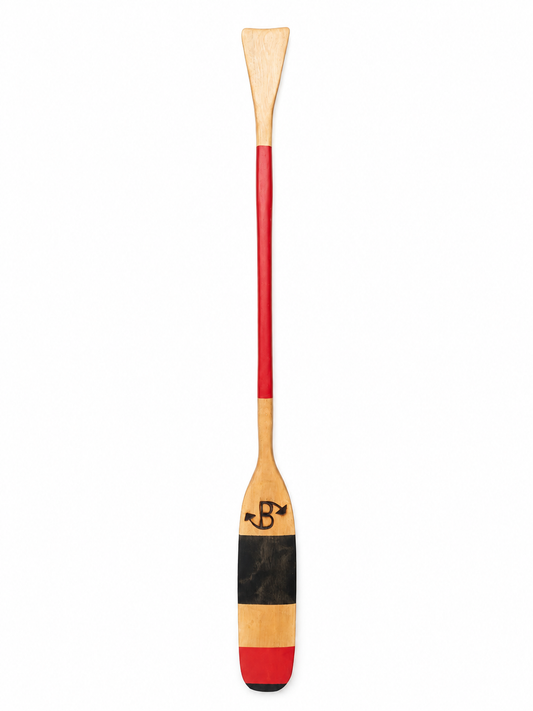 A single wooden paddle with a natural wood blade, a red shaft, and a black and red painted lower section, shown vertically on a plain white background.