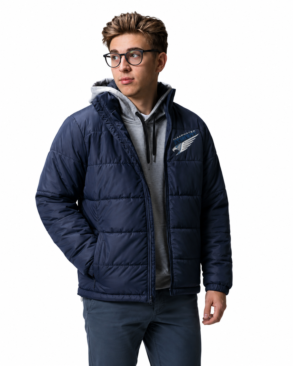 A man wearing a navy blue puffer jacket with a gray hoodie underneath, standing against a plain white background. The jacket features a Clearwater Icehawks logo on the left chest.