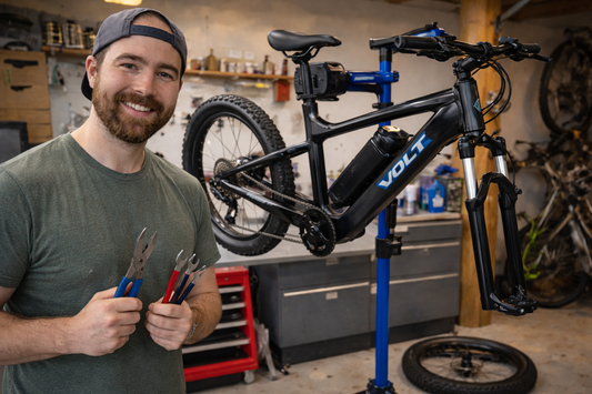 Maveric Northcott, owner of Wells Gray Outfitters in Clearwater BC performing a tune-up on an e-bike.