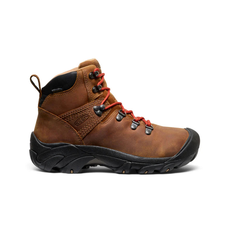 Brown leather Keen womens hiking boots with a black sole and orange laces.
