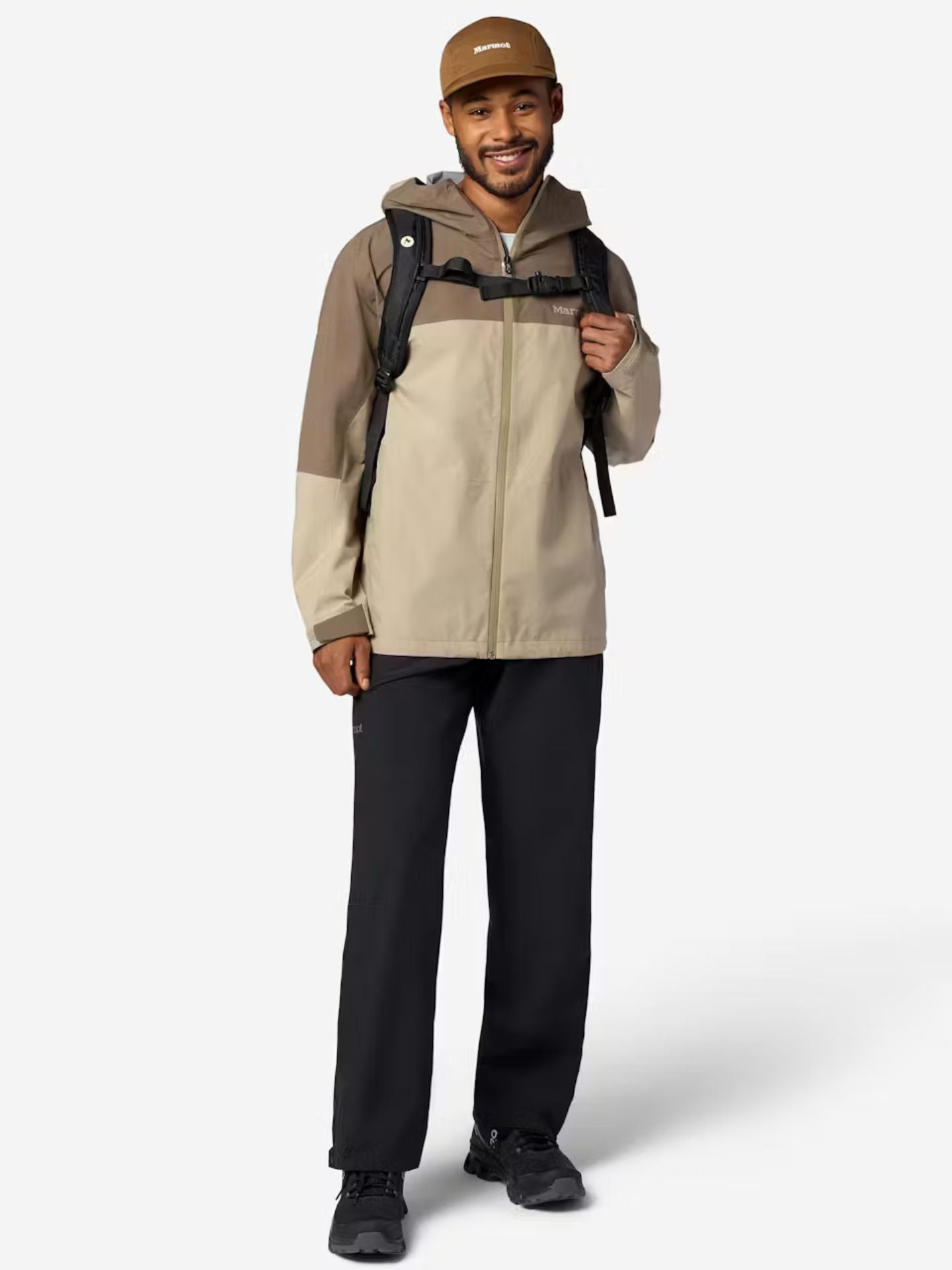 Model wearing black marmot rain pants