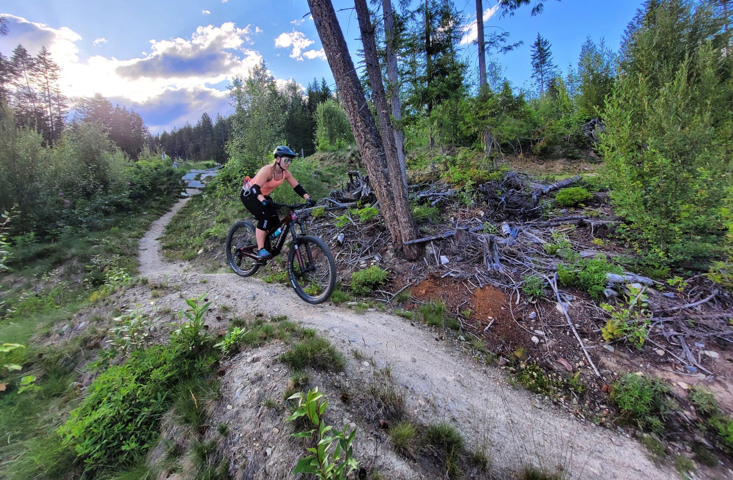 Young woman mountain biking on Fat Lip at Candle Creek near Wells Gray Park.