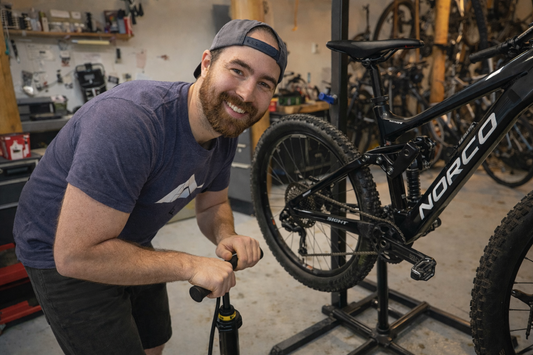 Maveric Northcott, owner of Wells Gray Outfitters in Clearwater BC performing a regular bike tune up