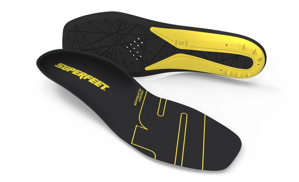 Black and yellow skate insoles with 'Superfeet' branding on a white background
