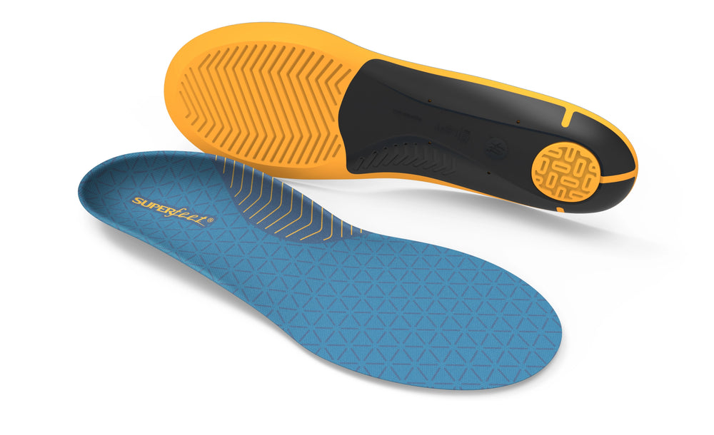 Blue and yellow Superfeet insoles on a white background