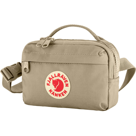 Beige Fjallraven Kanken Hip Pack with a red and white logo on a white background